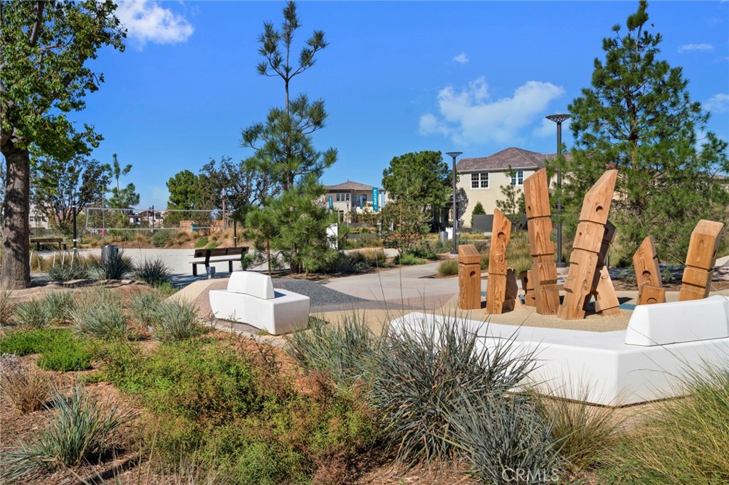 126 Scale Irvine, CA 92618 - Photo 46 of 75 a view of a swimming pool with an outdoor seating and a yard