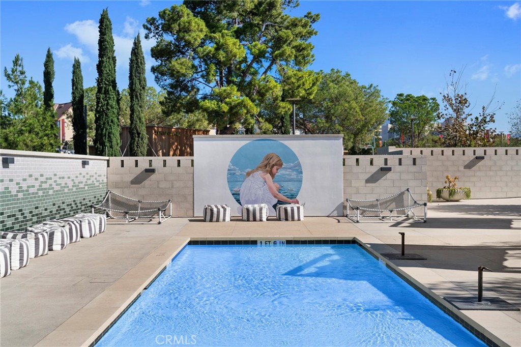 126 Scale Irvine, CA 92618 - Photo 52 of 75 a living room with furniture and a wooden floor