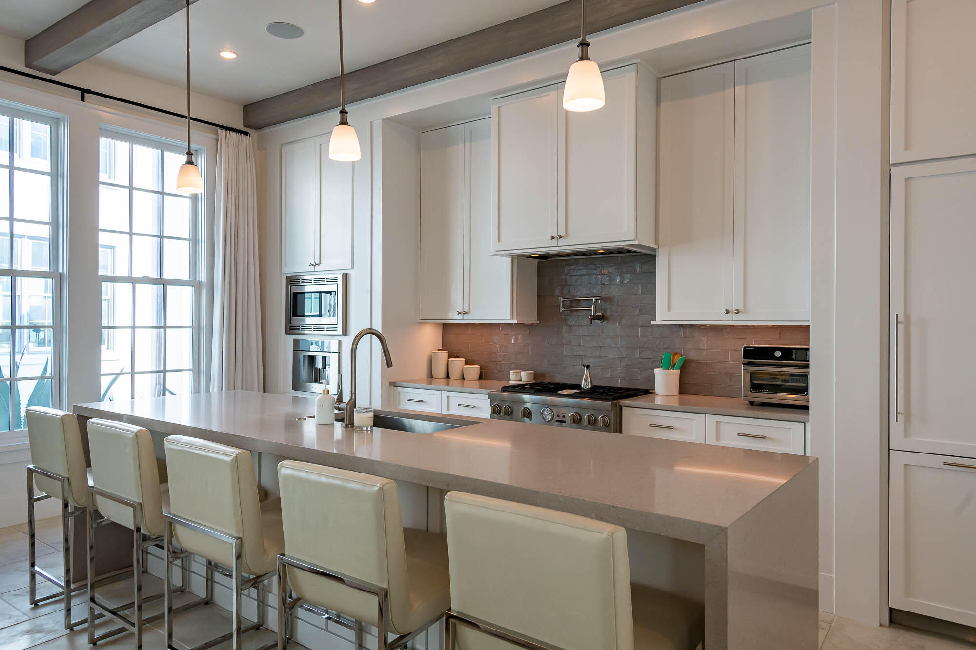 24 Sea Star Ct Inlet Beach Inlet Beach, FL 32461 - Photo 12 of 63 a kitchen with stainless steel appliances granite countertop a stove a sink a refrigerator and white cabinets with wooden floor