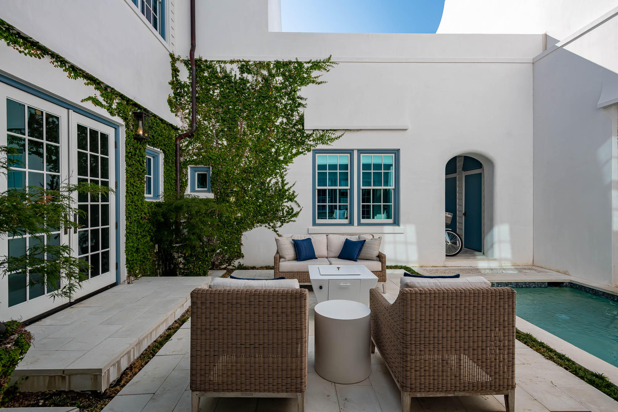 24 Sea Star Ct Inlet Beach Inlet Beach, FL 32461 - Photo 31 of 63 a view of a patio with couches table and chairs and potted plants
