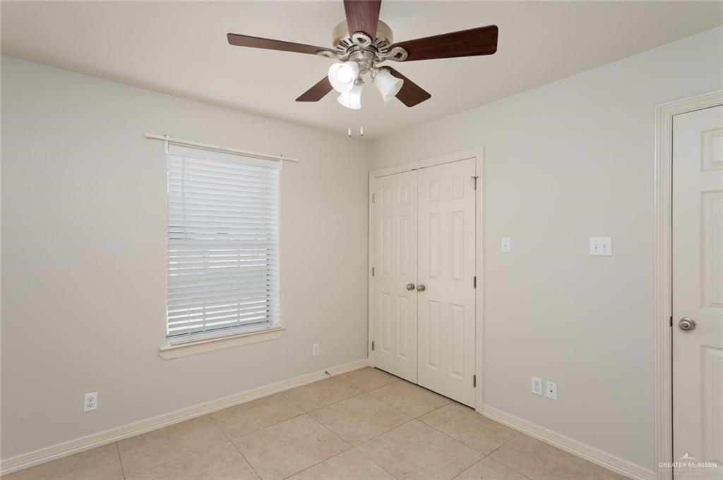 1105 West Stubbs Street, Unit 5 Edinburg, TX 78539 - Photo 8 of 12 a view of an empty room with a window