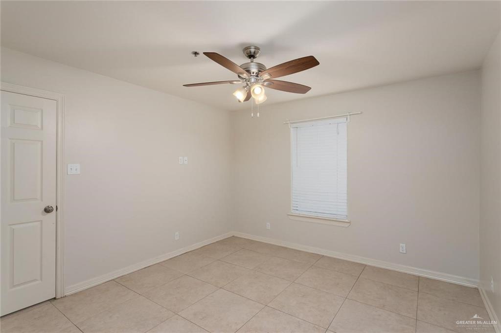 1105 West Stubbs Street, Unit 5 Edinburg, TX 78539 - Photo 9 of 12 wooden floor in an empty room