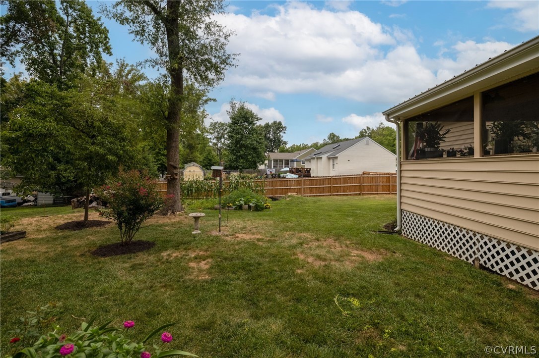 3130 Gregwood Road Midlothian, VA 23112 - Photo 34 of 39 a view of a garden with a bench