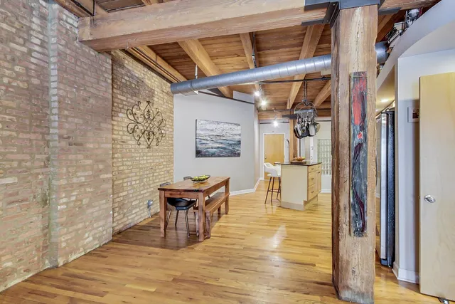 a view of a patio with table and chairs