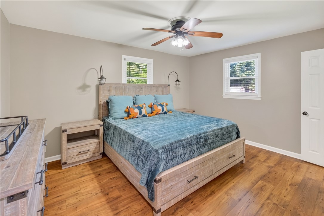 207 Ridgecrest Drive Williamston, SC 29697 - Photo 14 of 22 Rich wood floors lay a warm foundation for this comfortable sleeping space.