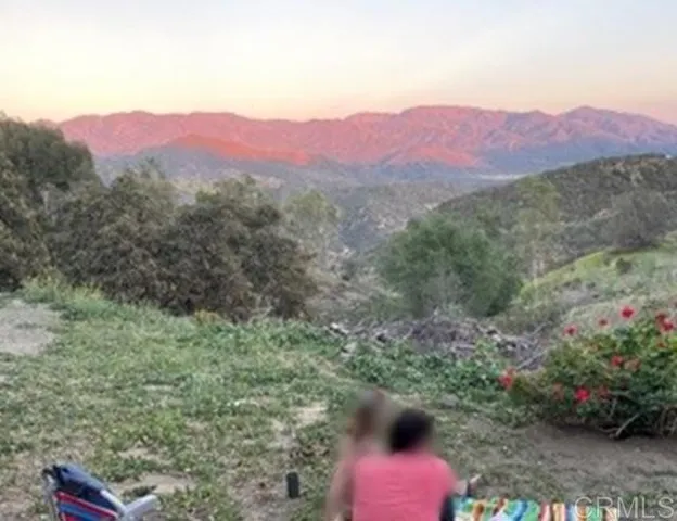 a view of a mountain with a outdoor space