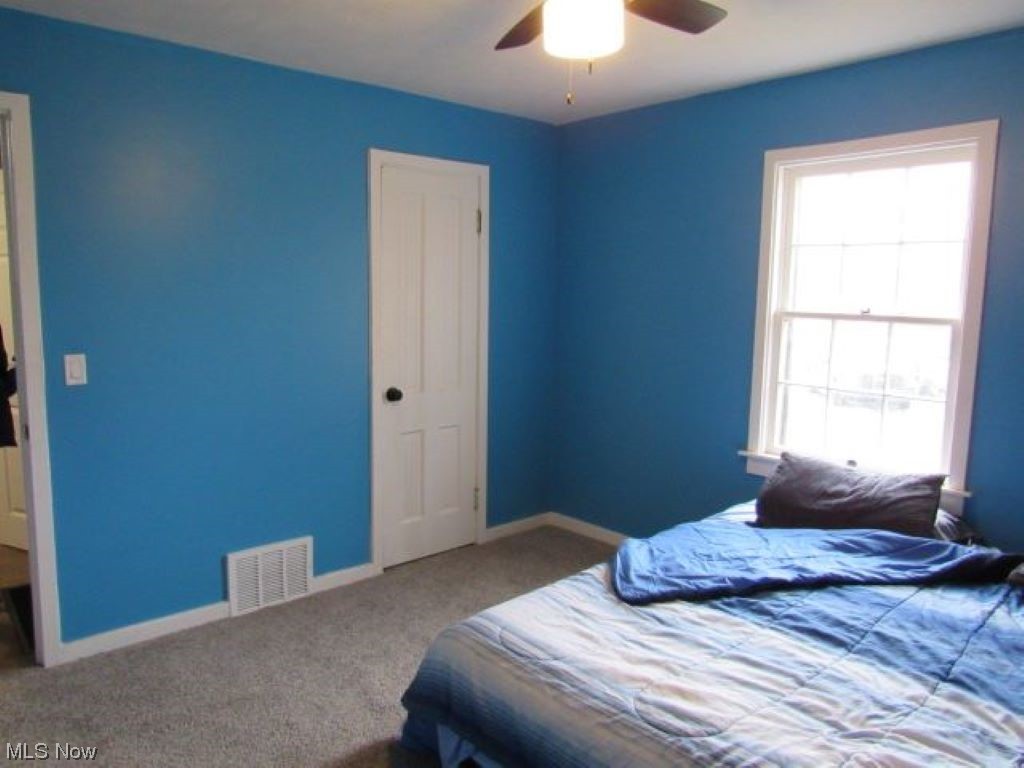 8528 Lafayette Road Lodi, OH 44254 - Photo 11 of 22 Bedroom featuring light carpet and ceiling fan