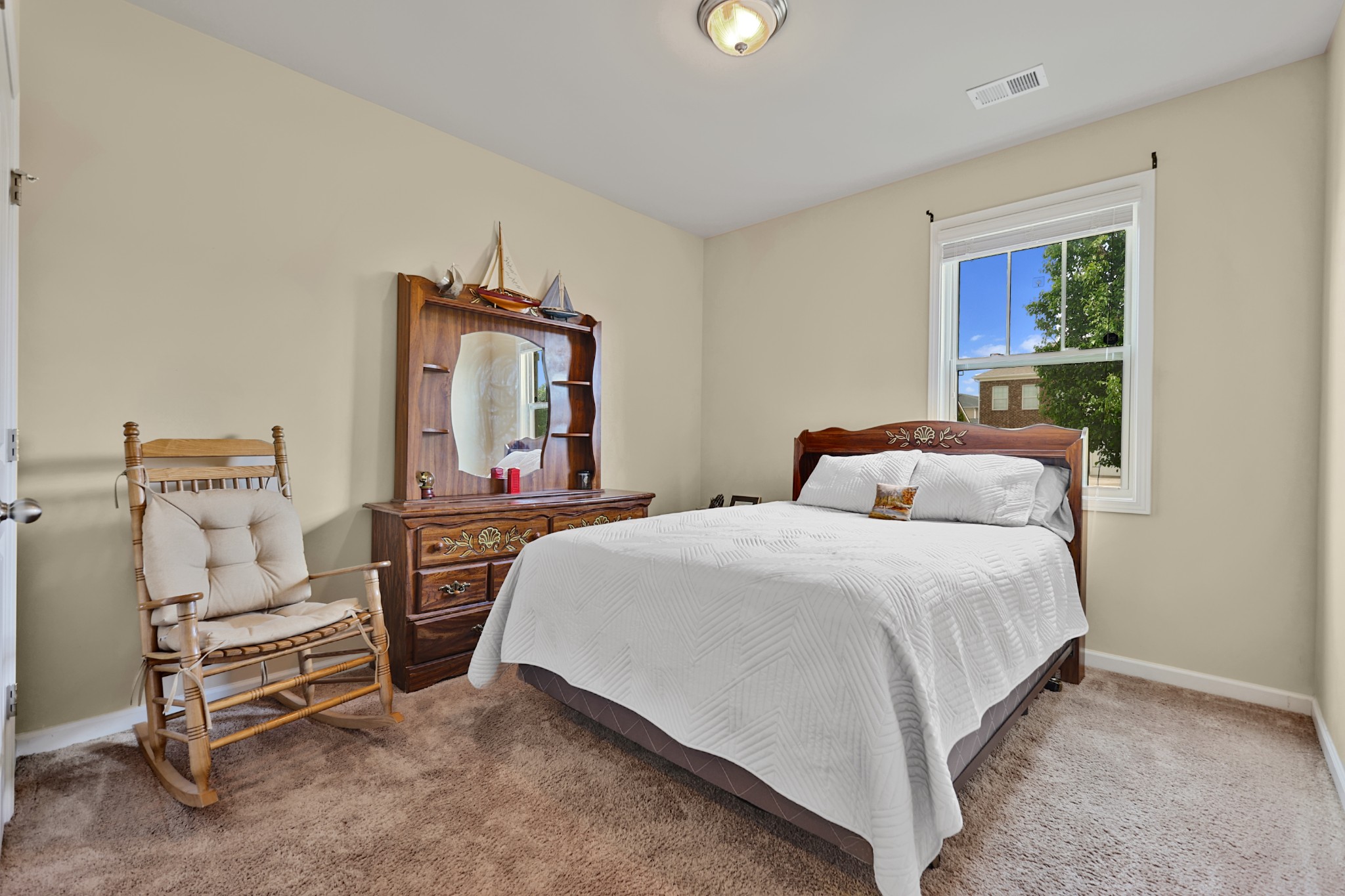 6515 Tulip Tree Drive Murfreesboro, TN 37128 - Photo 16 of 21 a bedroom with a bed chair and window