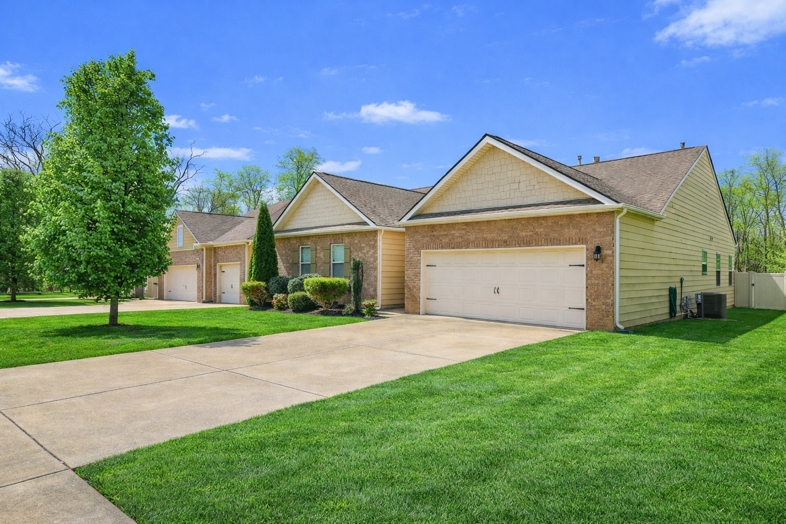 6515 Tulip Tree Drive Murfreesboro, TN 37128 - Photo 2 of 21 a front view of a house with a yard and garage
