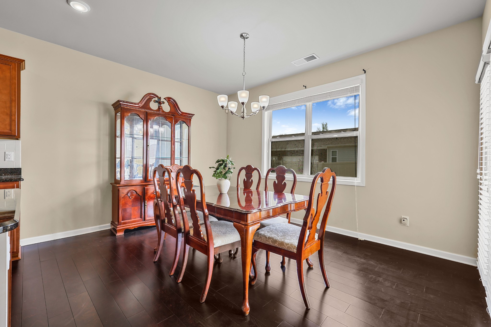 6515 Tulip Tree Drive Murfreesboro, TN 37128 - Photo 9 of 21 a dining room with furniture a chandelier and wooden floor