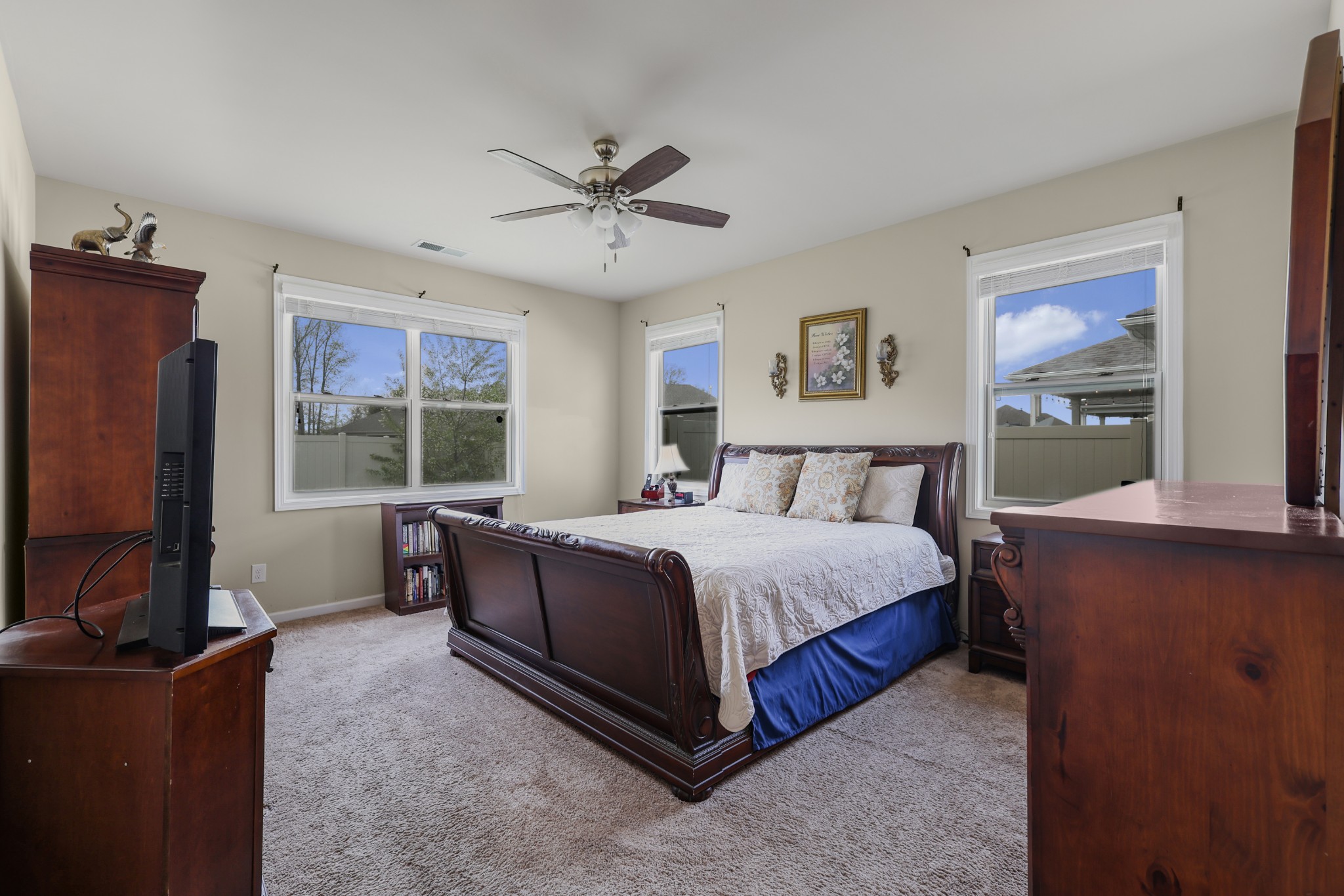 6515 Tulip Tree Drive Murfreesboro, TN 37128 - Photo 10 of 21 a bedroom with a bed flat screen tv and window