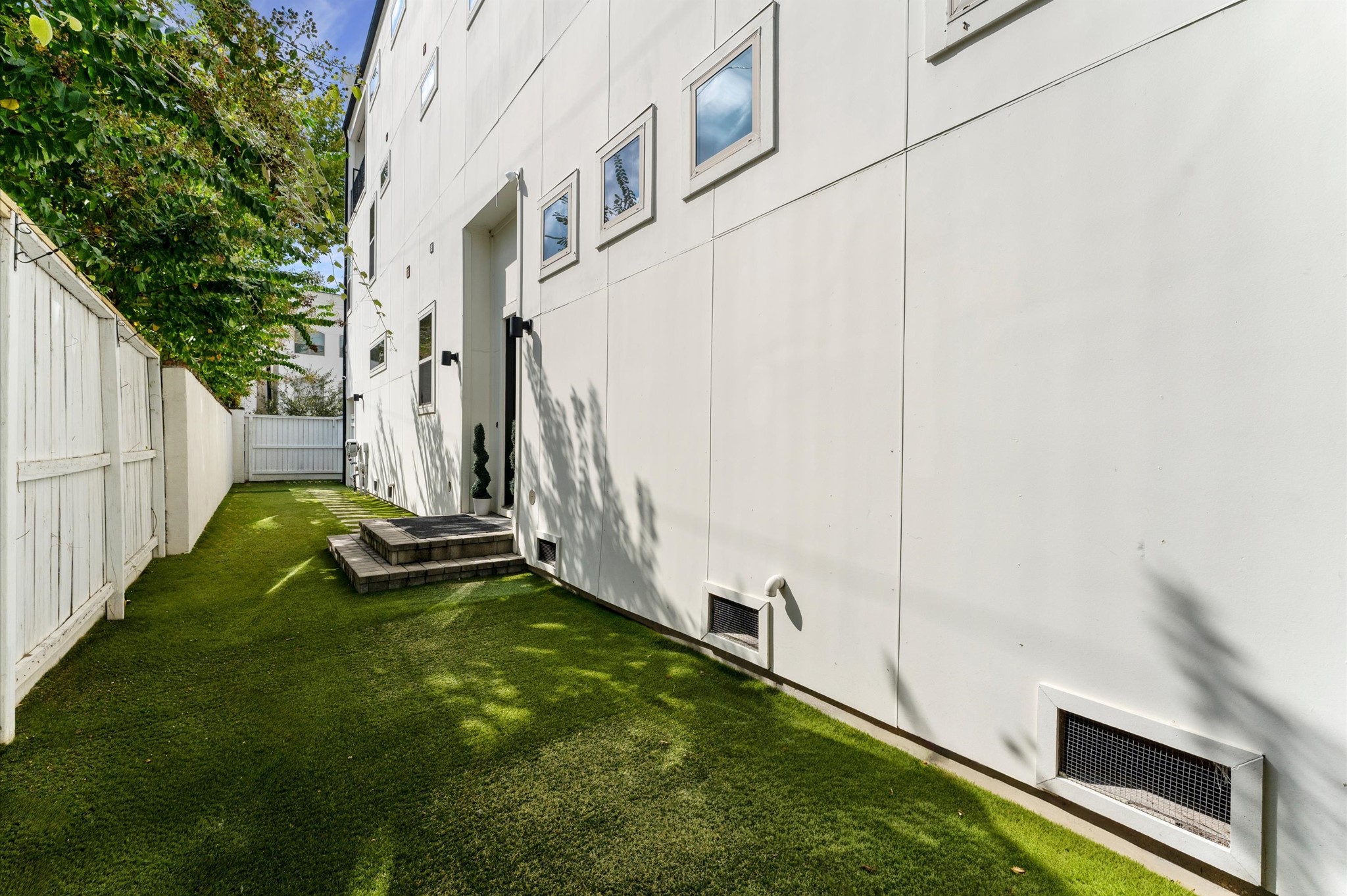 1902 West 25th Street Houston, TX 77008 - Photo 16 of 49 a view of an house with backyard space and swimming pool
