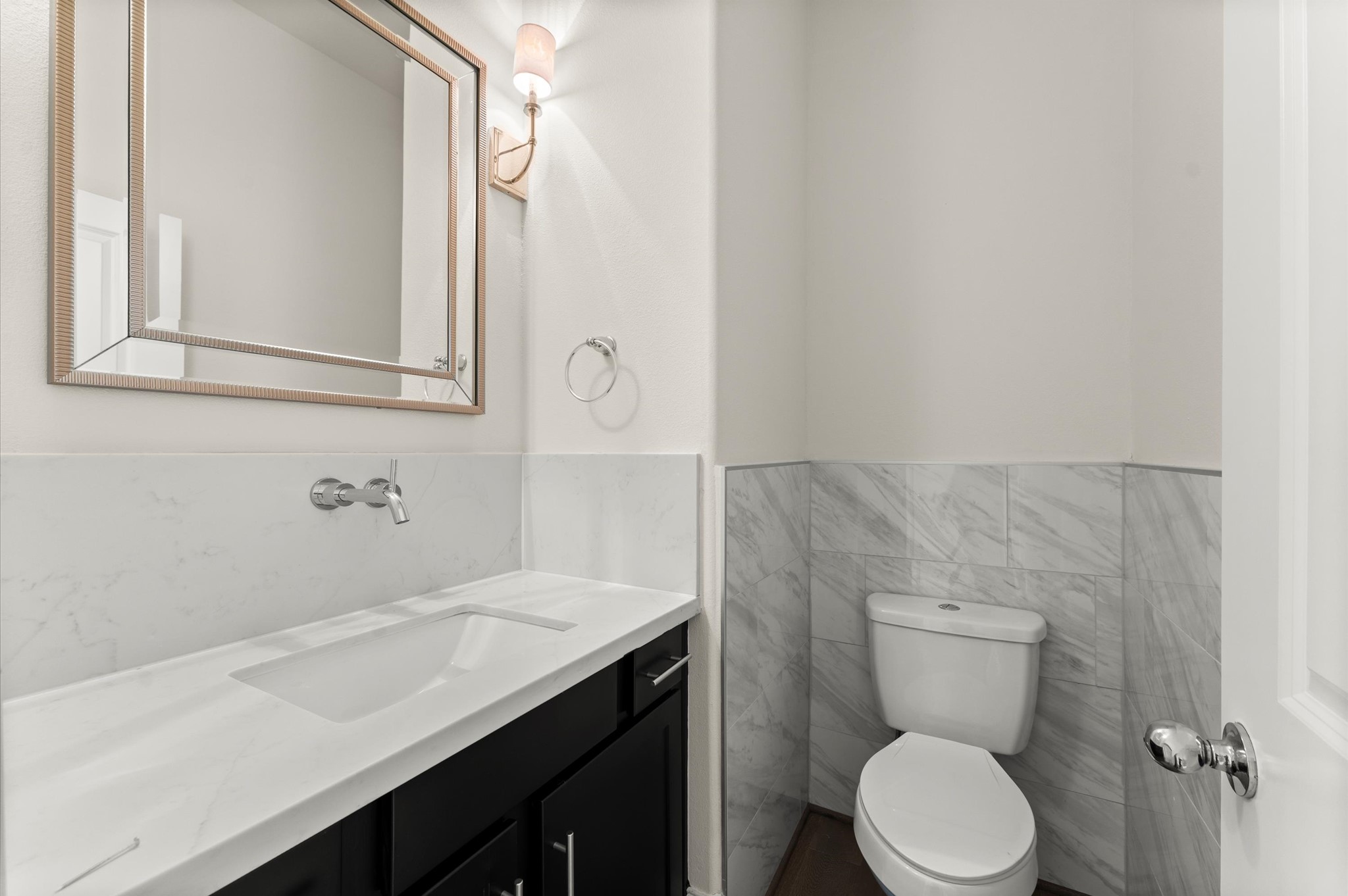 1902 West 25th Street Houston, TX 77008 - Photo 19 of 49 a bathroom with a sink a toilet and mirror