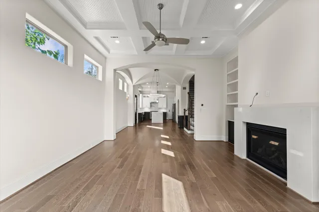 a view of an empty room and a fireplace