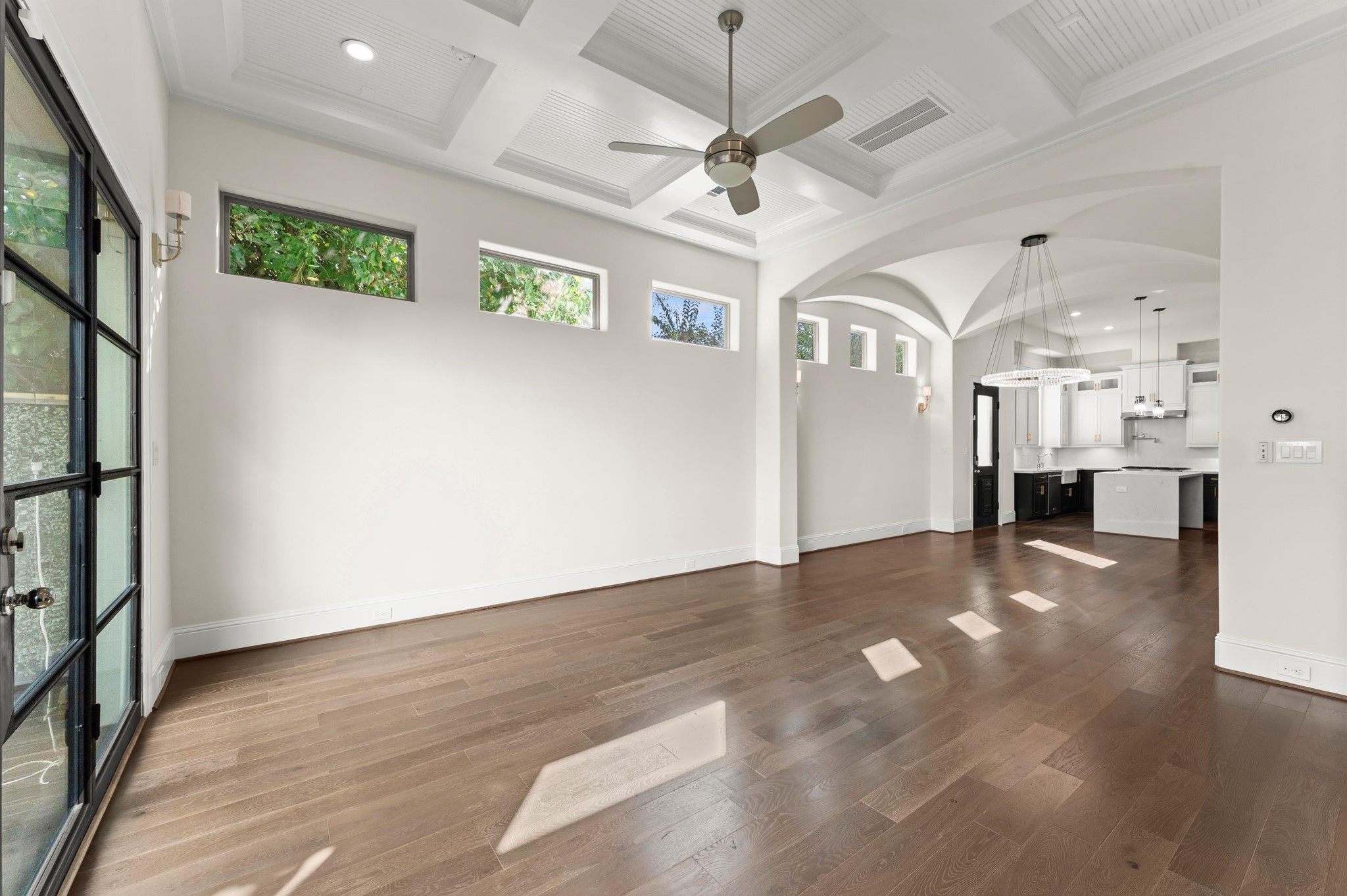 1902 West 25th Street Houston, TX 77008 - Photo 24 of 49 a view of a hallway with wooden floor and a kitchen