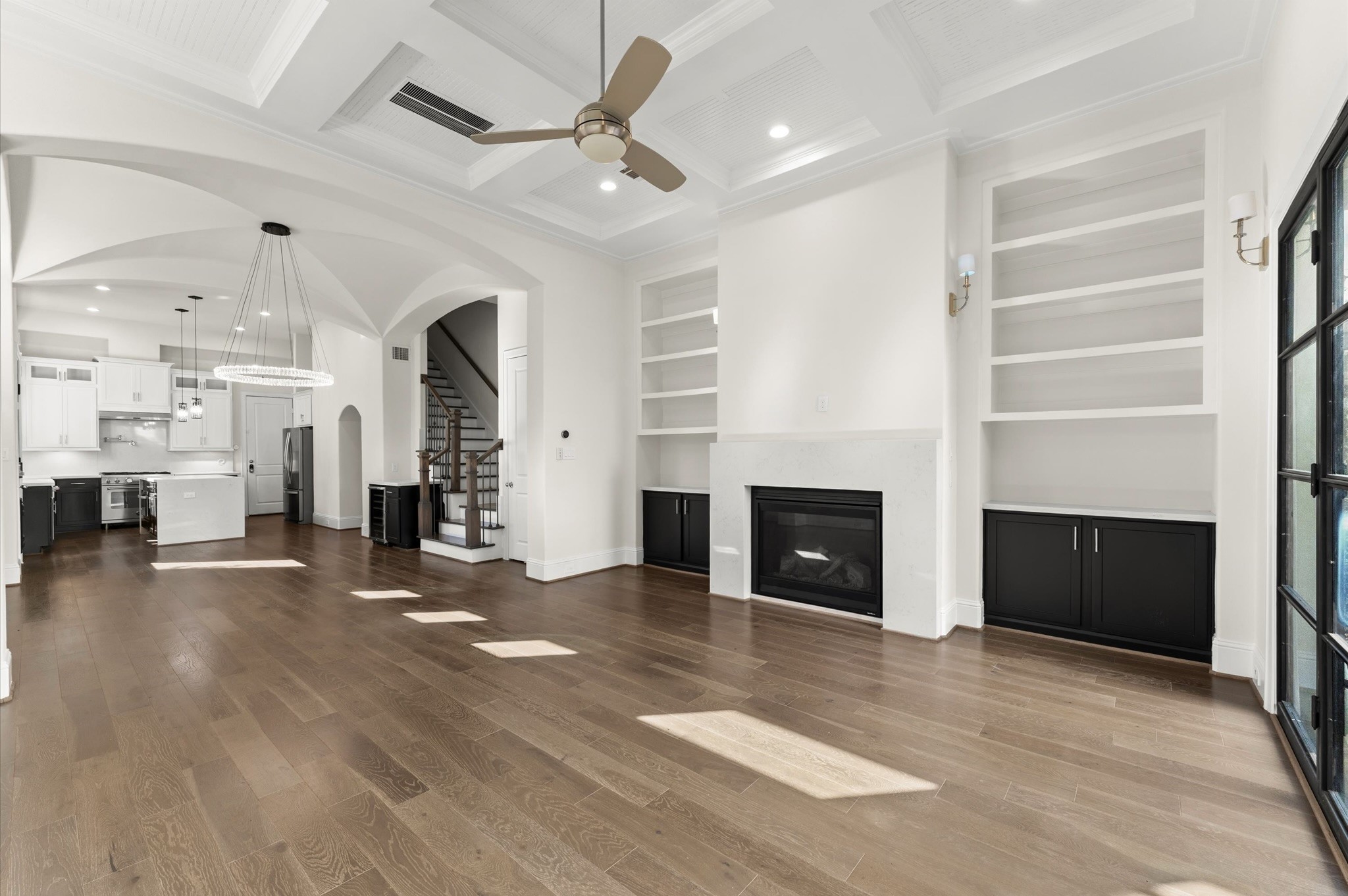 1902 West 25th Street Houston, TX 77008 - Photo 25 of 49 a view of a livingroom with a fireplace a ceiling fan and windows