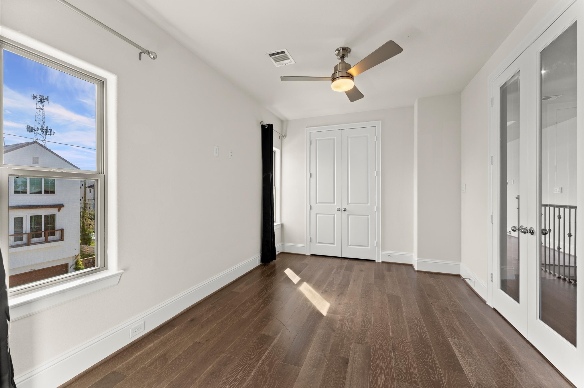 1902 West 25th Street Houston, TX 77008 - Photo 37 of 49 a view of a livingroom with wooden floor and a ceiling fan
