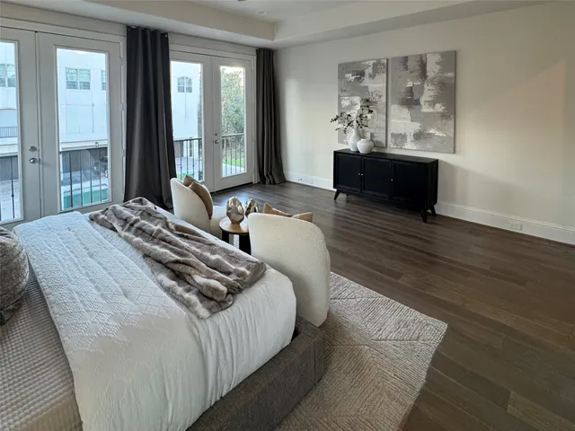 a bedroom with double bed and a window