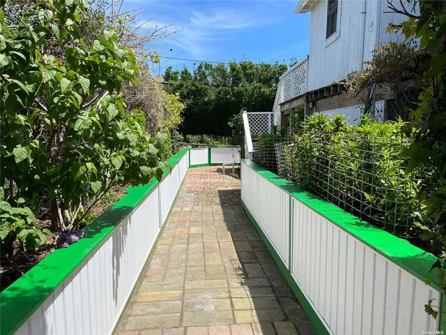 a kitchen with stainless steel appliances a stove a sink and a microwave