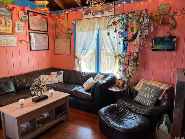 a bedroom with a bed and windows