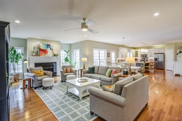 a front view of a house with garden and trees