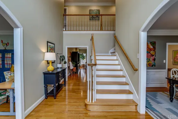 a view of a room with lots of stuff and hardwood floor