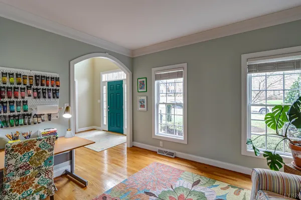 a bathroom with a granite countertop sink and a bathtub