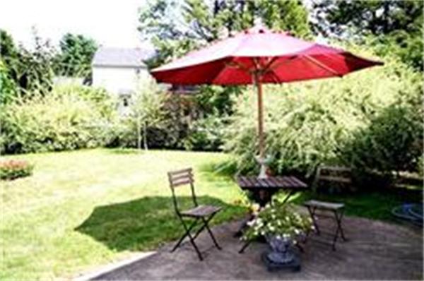 65 Shaker Road Longmeadow, MA 01106 - Photo 14 of 16 a view of a garden with an umbrella
