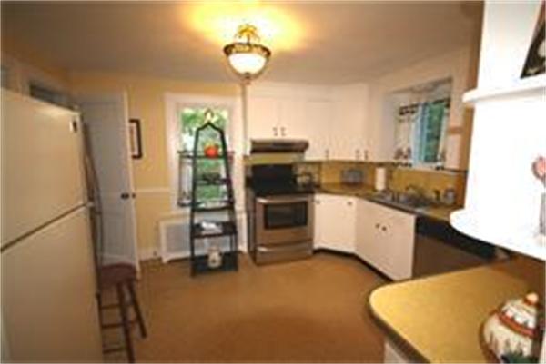 65 Shaker Road Longmeadow, MA 01106 - Photo 4 of 16 a kitchen with a refrigerator a oven and a sink