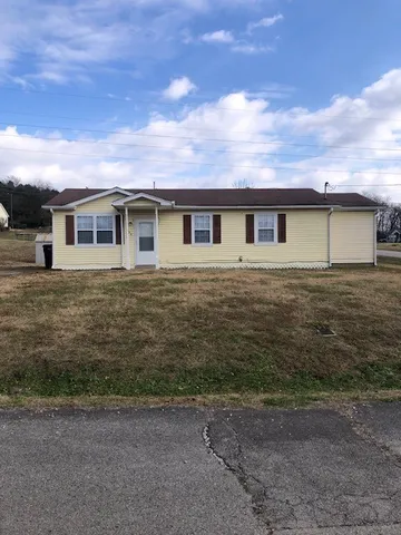 a front view of a house with yard