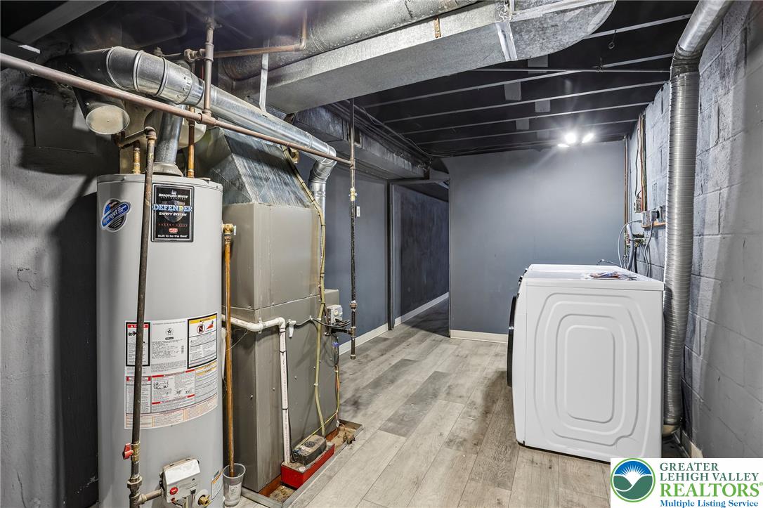 4008 Powell Road Brookhaven, PA 19015 - Photo 27 of 36 Functional basement space with exposed ductwork and essential utility hookups.