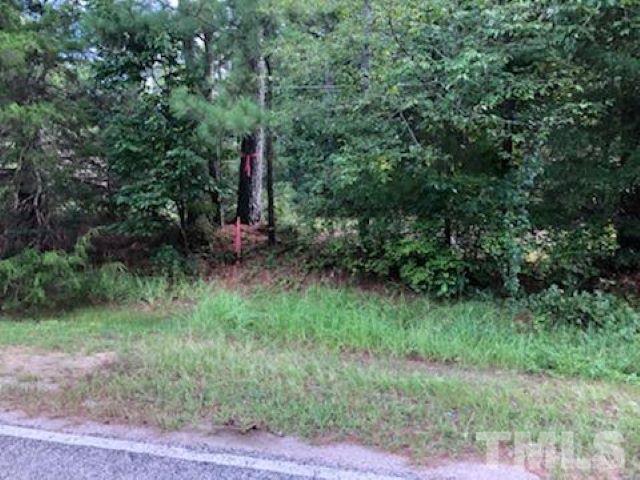 Lot Evans Road Henderson, NC 27537 - Photo 3 of 7 a view of a green field with lots of bushes