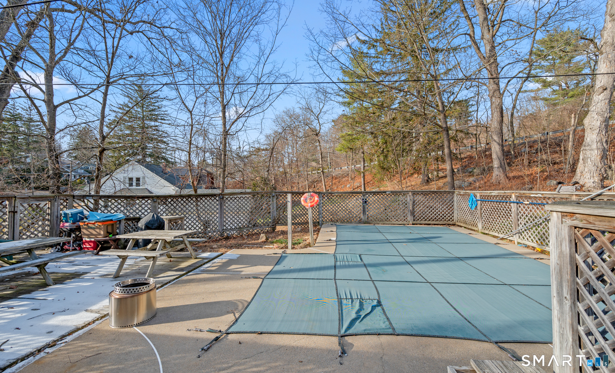 10 Old Waterbury Road Middlebury, CT 06762 - Photo 11 of 12 a view of a patio with a table and chairs with wooden fence