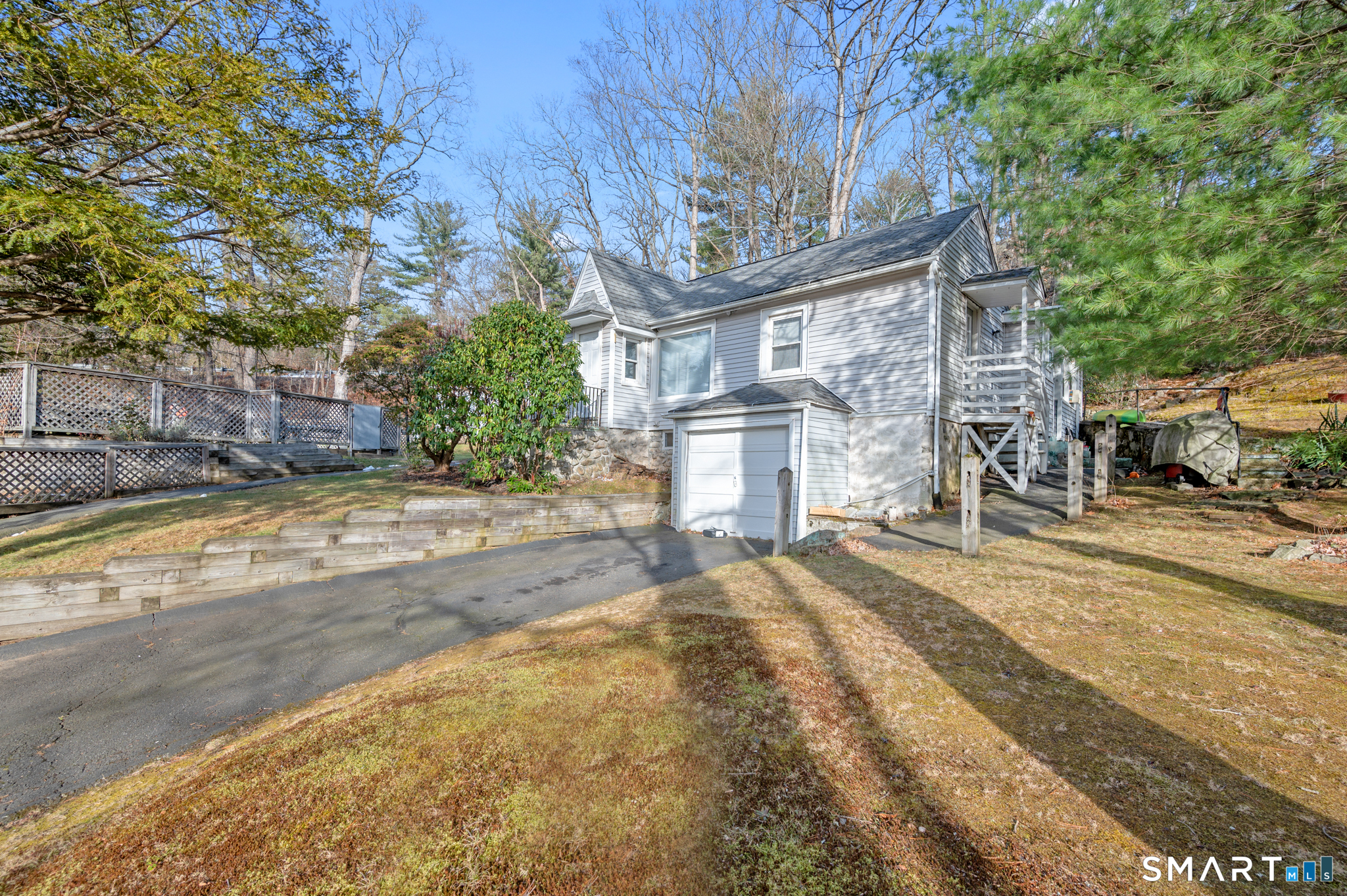 10 Old Waterbury Road Middlebury, CT 06762 - Photo 2 of 12 a view of a house with a yard and pathway