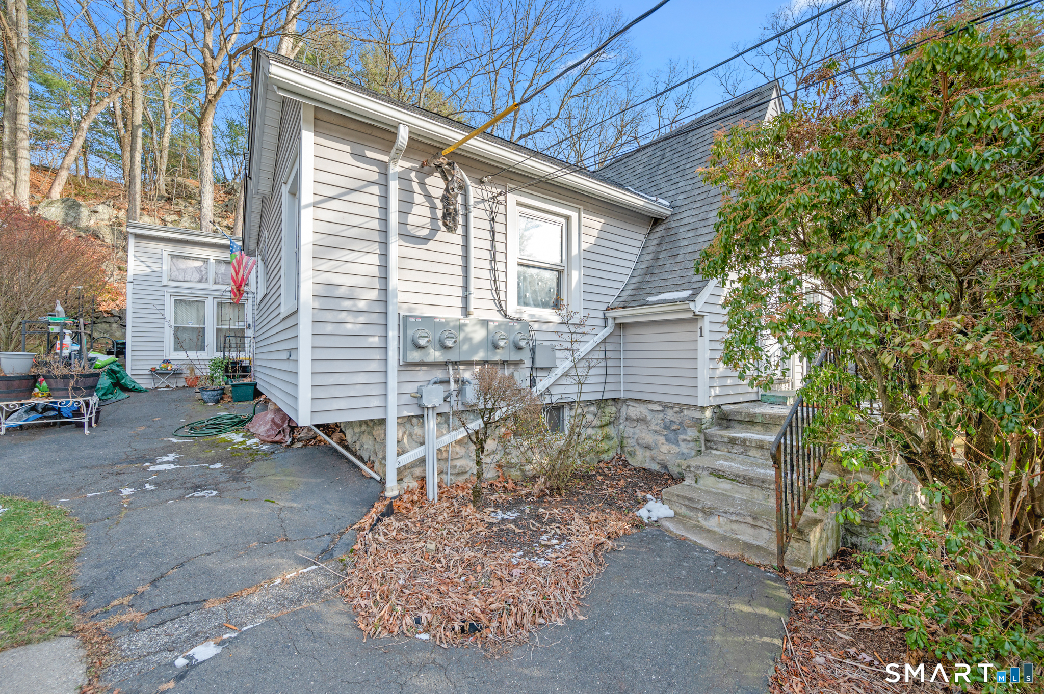 10 Old Waterbury Road Middlebury, CT 06762 - Photo 6 of 12 a yellow house with outdoor space