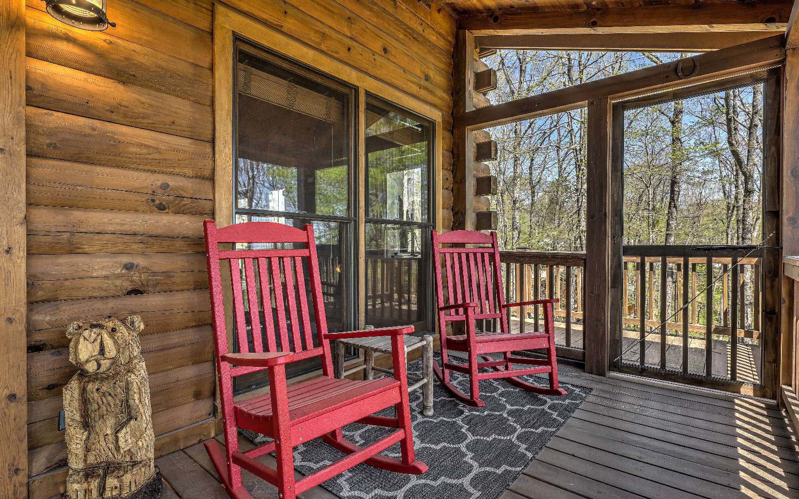 78 Little Bushy Head Road Blue Ridge, GA 30513 - Photo 2 of 4 a front view of a house with outdoor seating