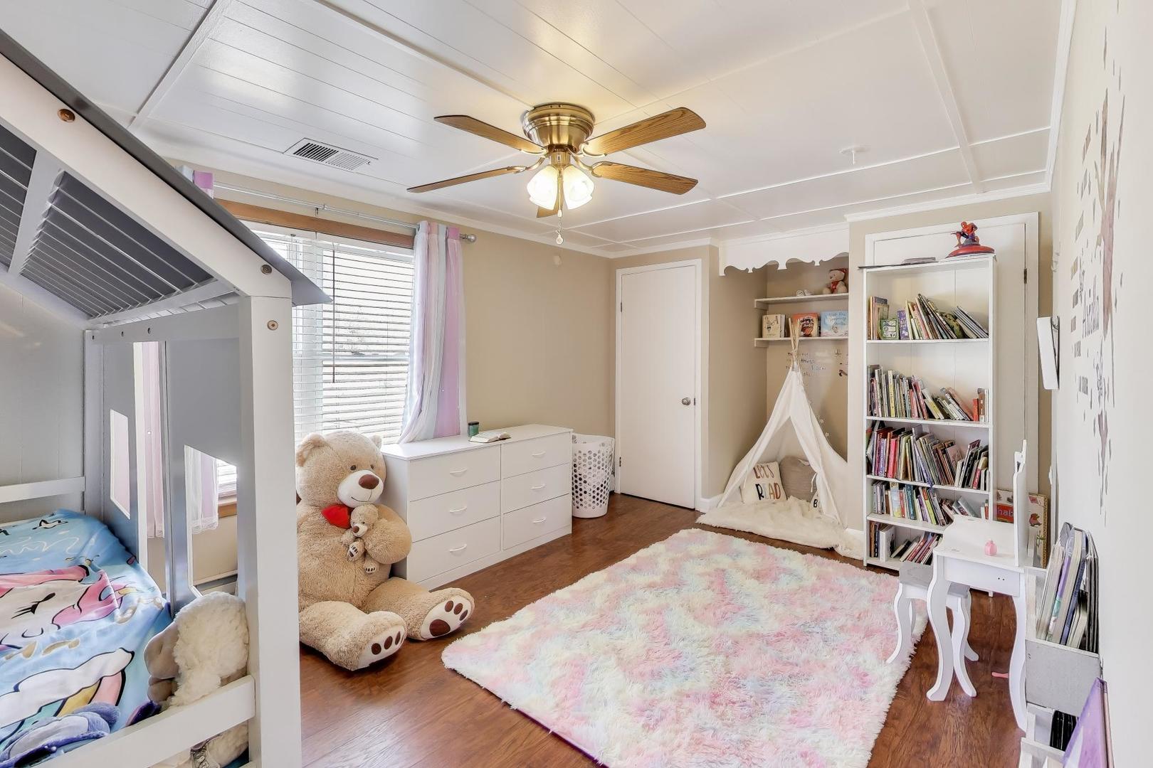 29 Iowa Avenue Addison, IL 60101 - Photo 17 of 22 a bed room with a bed and a chandelier
