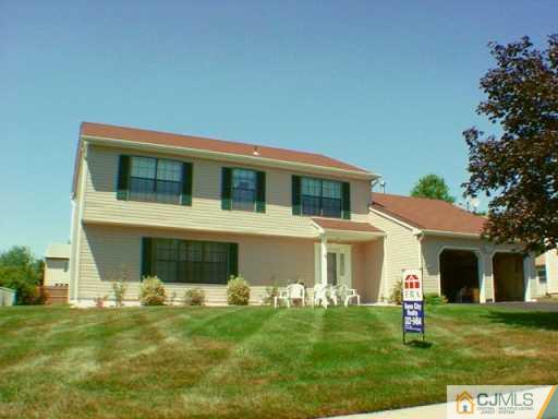 45 Higgins Road Old Bridge, NJ 08857 - Photo 2 of 2 a front view of a house with a yard