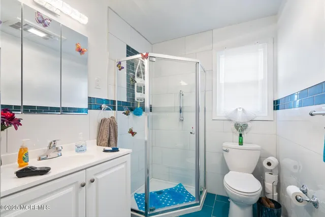 a bedroom with a bed and a mirror