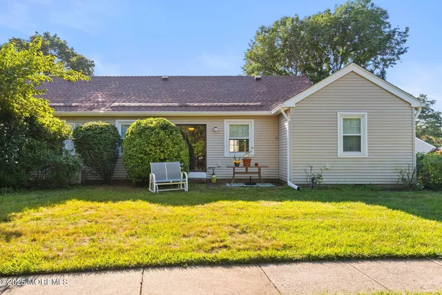 a view of a yard with an outdoor space and seating area