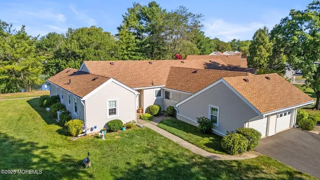 an aerial view of a house with a garden