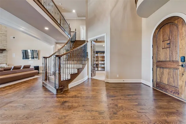 a view of entryway with stairs and wooden floor