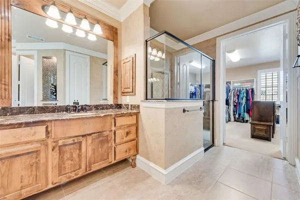a spacious bathroom with a granite countertop tub sink and mirror