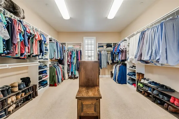 a bathroom with a sink a mirror and a vanity