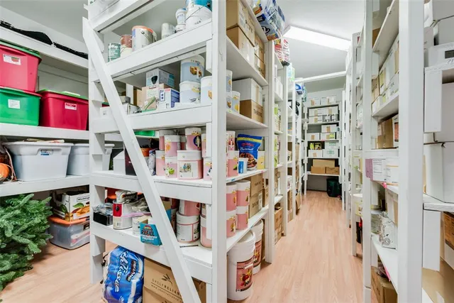 a view of a room with gym equipment and windows