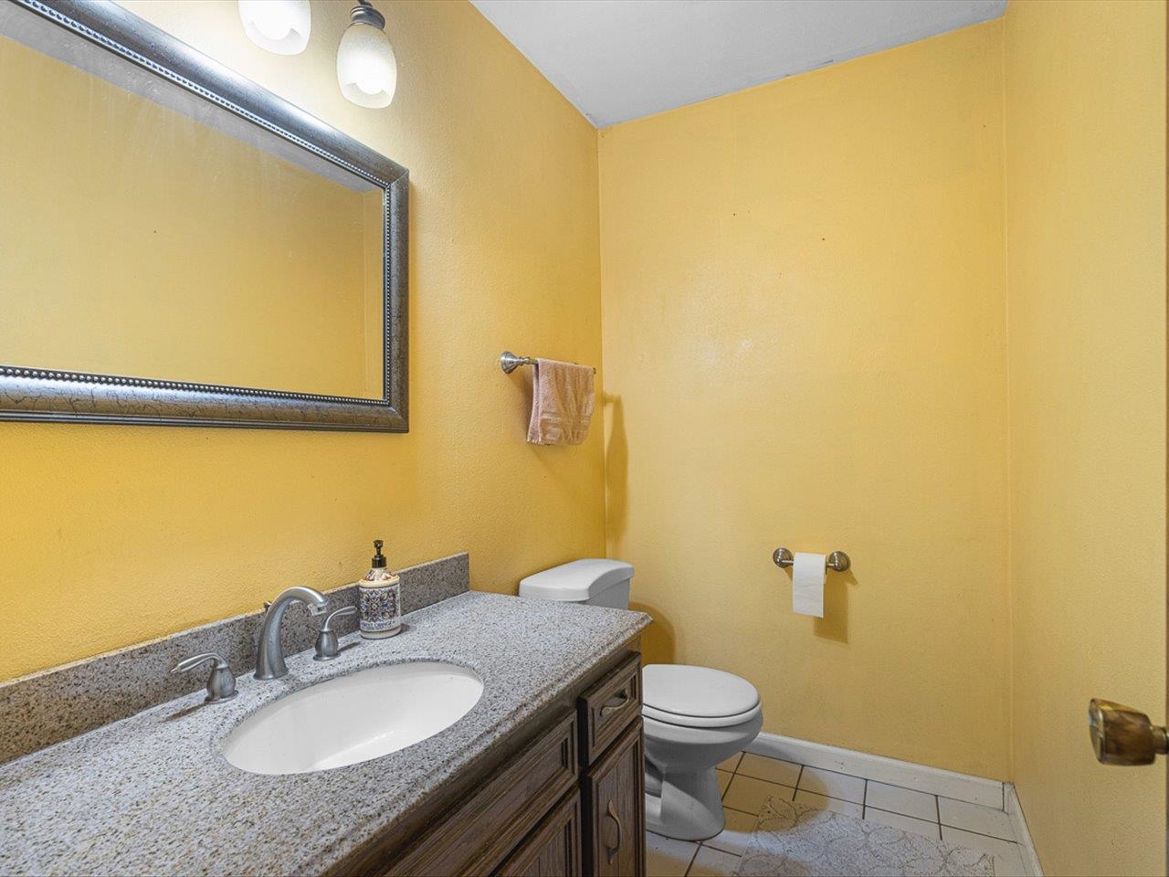 10383 Atwood Road Roscoe, IL 61073 - Photo 20 of 42 a bathroom with a granite countertop sink and a mirror