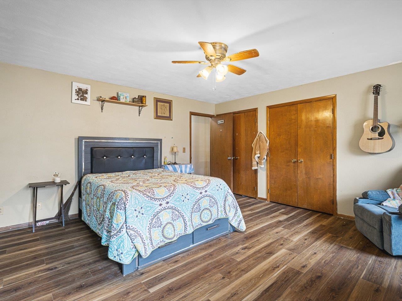 10383 Atwood Road Roscoe, IL 61073 - Photo 26 of 42 a bedroom with a bed and a chandelier