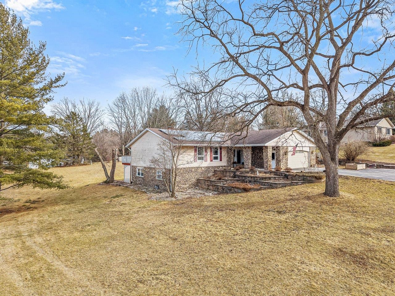 10383 Atwood Road Roscoe, IL 61073 - Photo 3 of 42 a large tree in front of a house