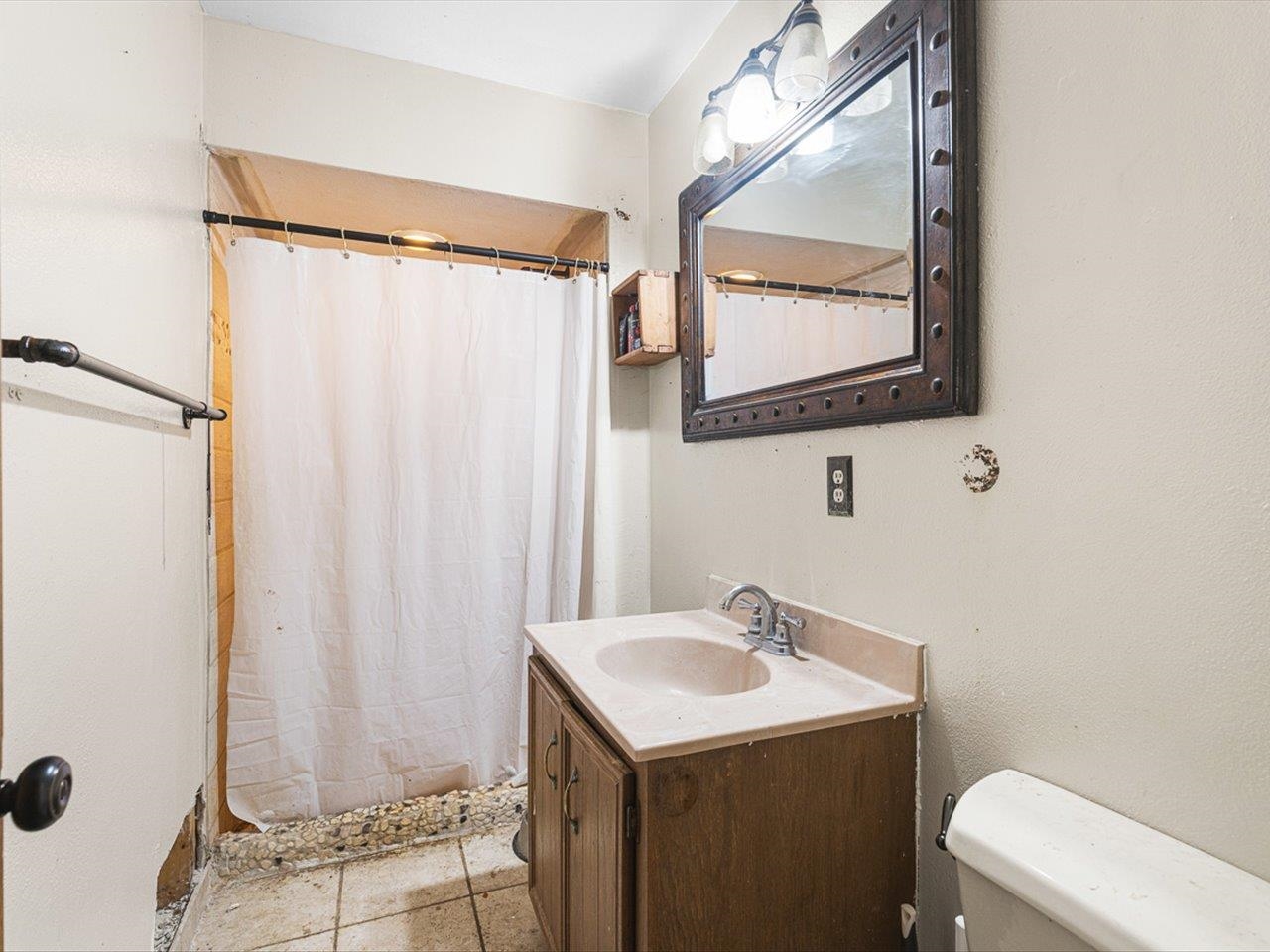 10383 Atwood Road Roscoe, IL 61073 - Photo 31 of 42 a bathroom with a sink and mirror with toilet