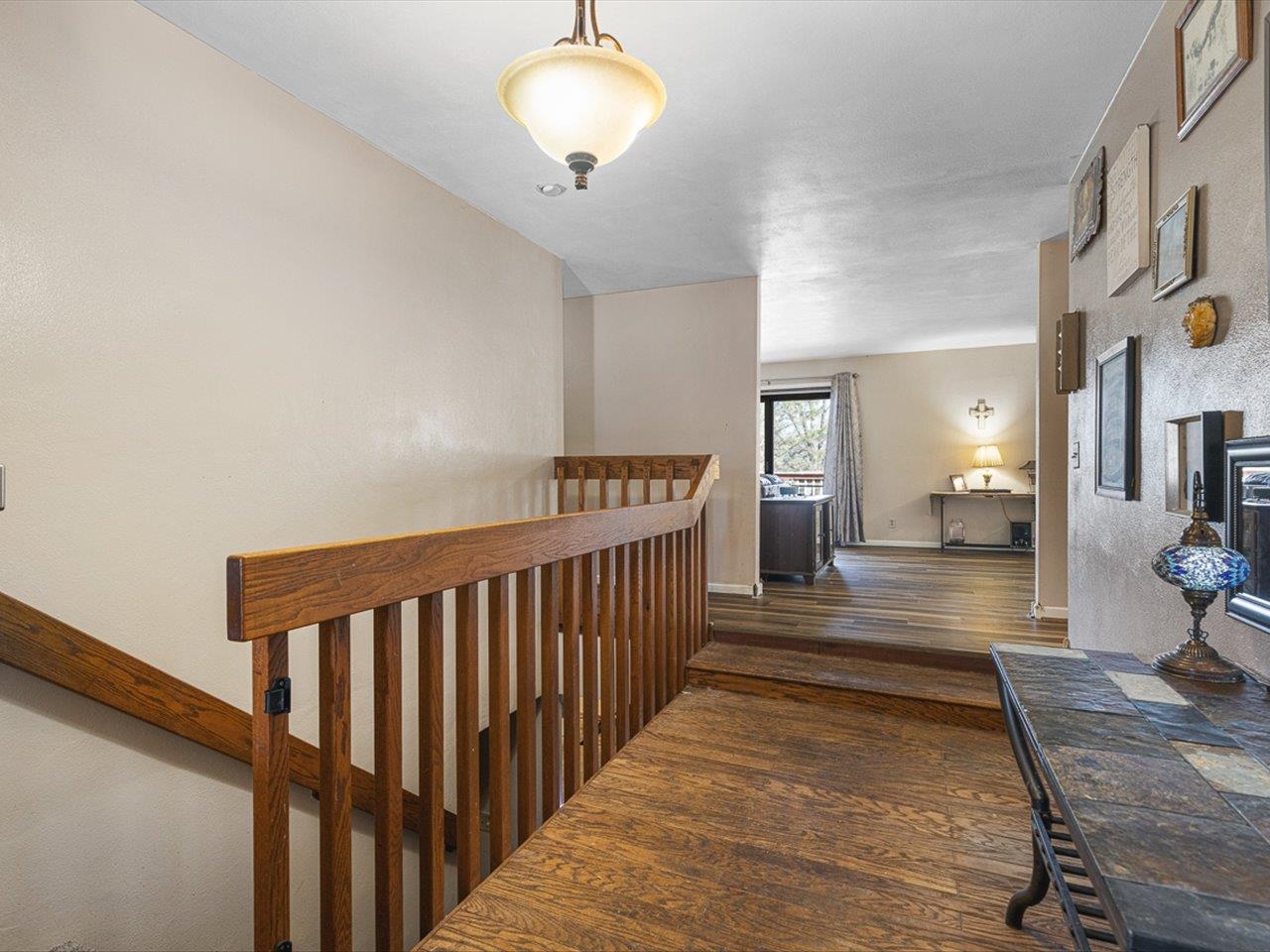 10383 Atwood Road Roscoe, IL 61073 - Photo 5 of 42 a view of a hallway with a couch and chandelier